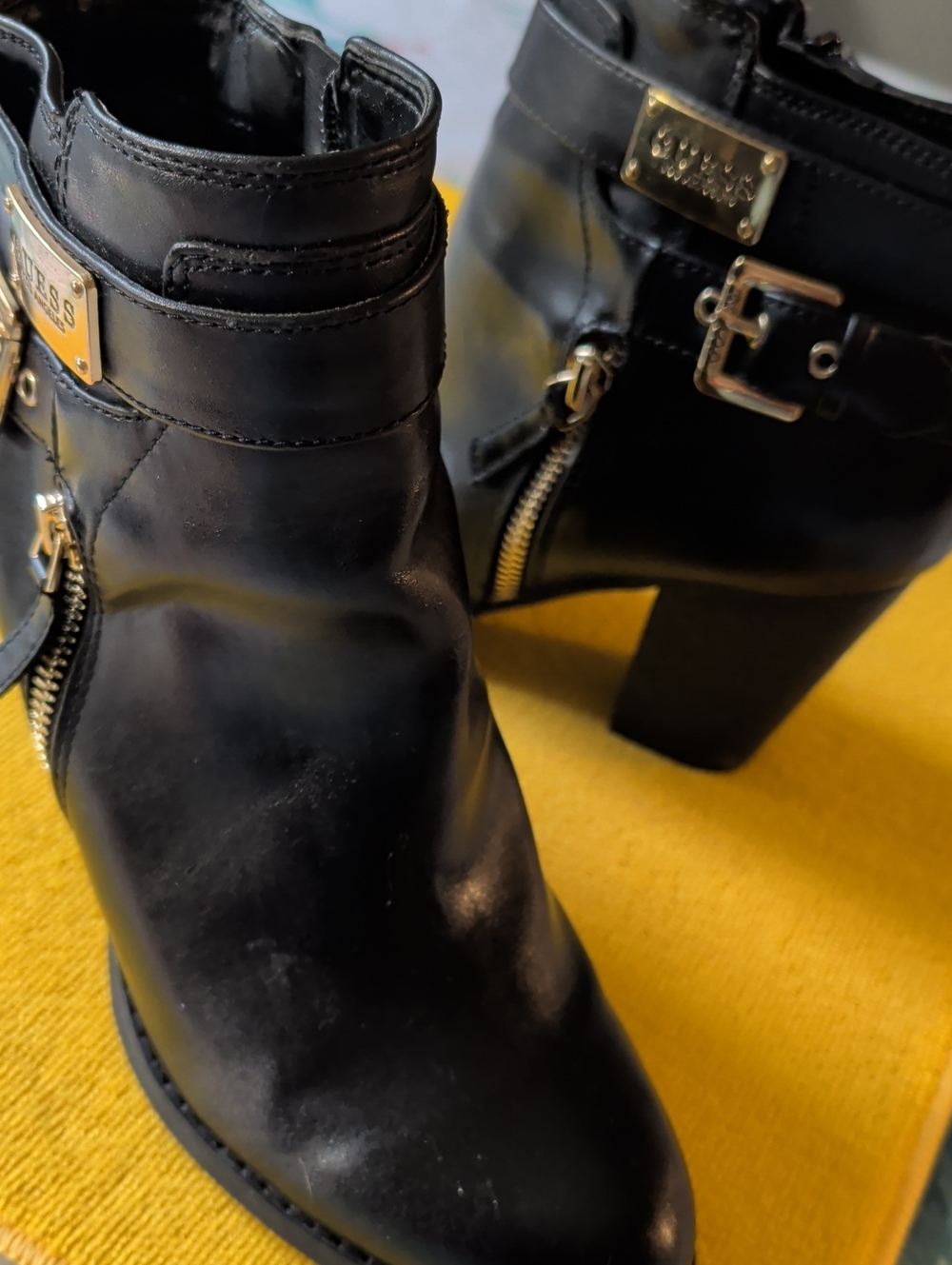 GUESS Black Leather Ankle Booties with Gold Hardware